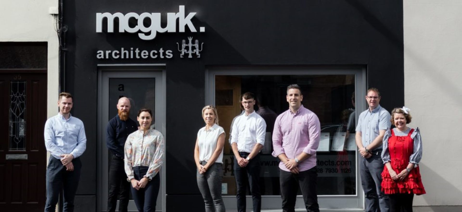 9 building front with staff2bigger min 1024x470 1